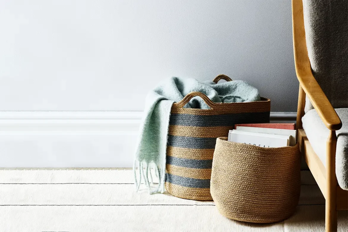 Natural jute storage basket with handles for versatile organization.