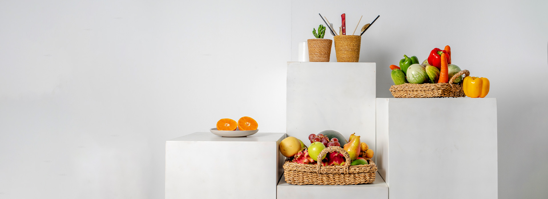 Handwoven seagrass fruit basket for displaying and storing fresh fruit.