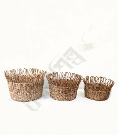 Handwoven seagrass fruit basket for displaying and storing fresh fruit.