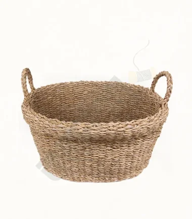 Handwoven seagrass vegetable basket for storing fresh produce.