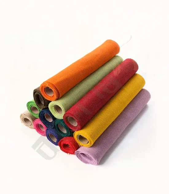 Colorful dyed burlap roll in vibrant hues for crafting and decorating.