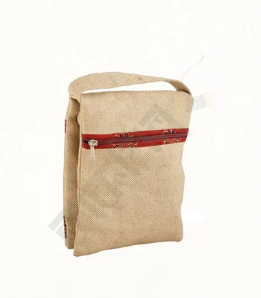 Natural jute sling bag with a stylish design and adjustable strap.