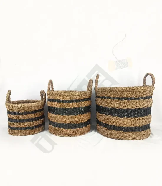 Set of handwoven seagrass planter baskets in various sizes, perfect for indoor plants.