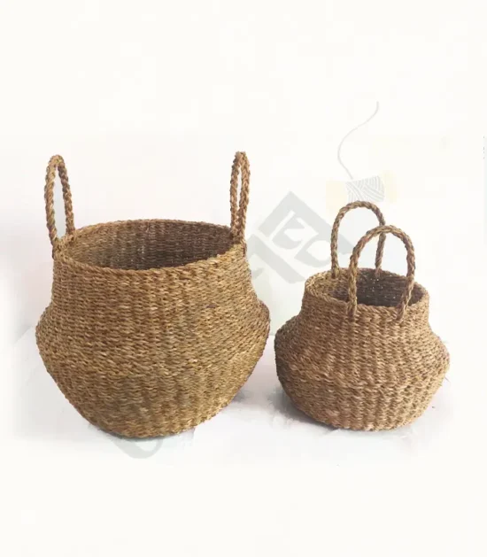 Handwoven seagrass belly basket with a natural texture and sturdy handles.